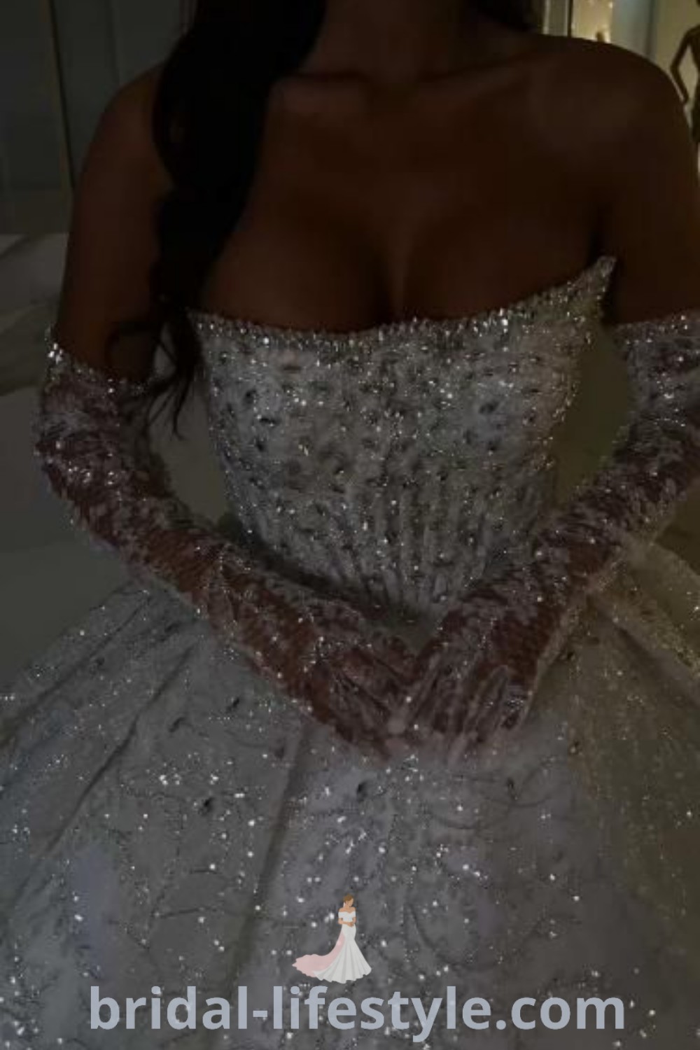 A stunning silver ball gown dress adorned with Swarovski crystals, perfect for romantic brides seeking dreamy elegance. This exquisite wedding dress represents extravagant styles and trends while offering a unique aesthetic for every bride. Discover more inspiration and ideas for your special day at bridal-lifestyle.com.