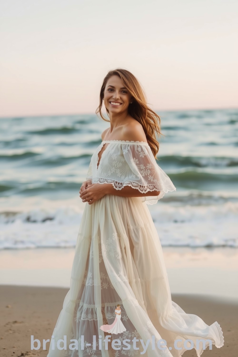 Whimsical boho wedding dress made of lace and cotton, featuring floral appliqués, off-the-shoulder neckline, and tiered layers, set against a serene beach backdrop. bridal-lifestyle.com