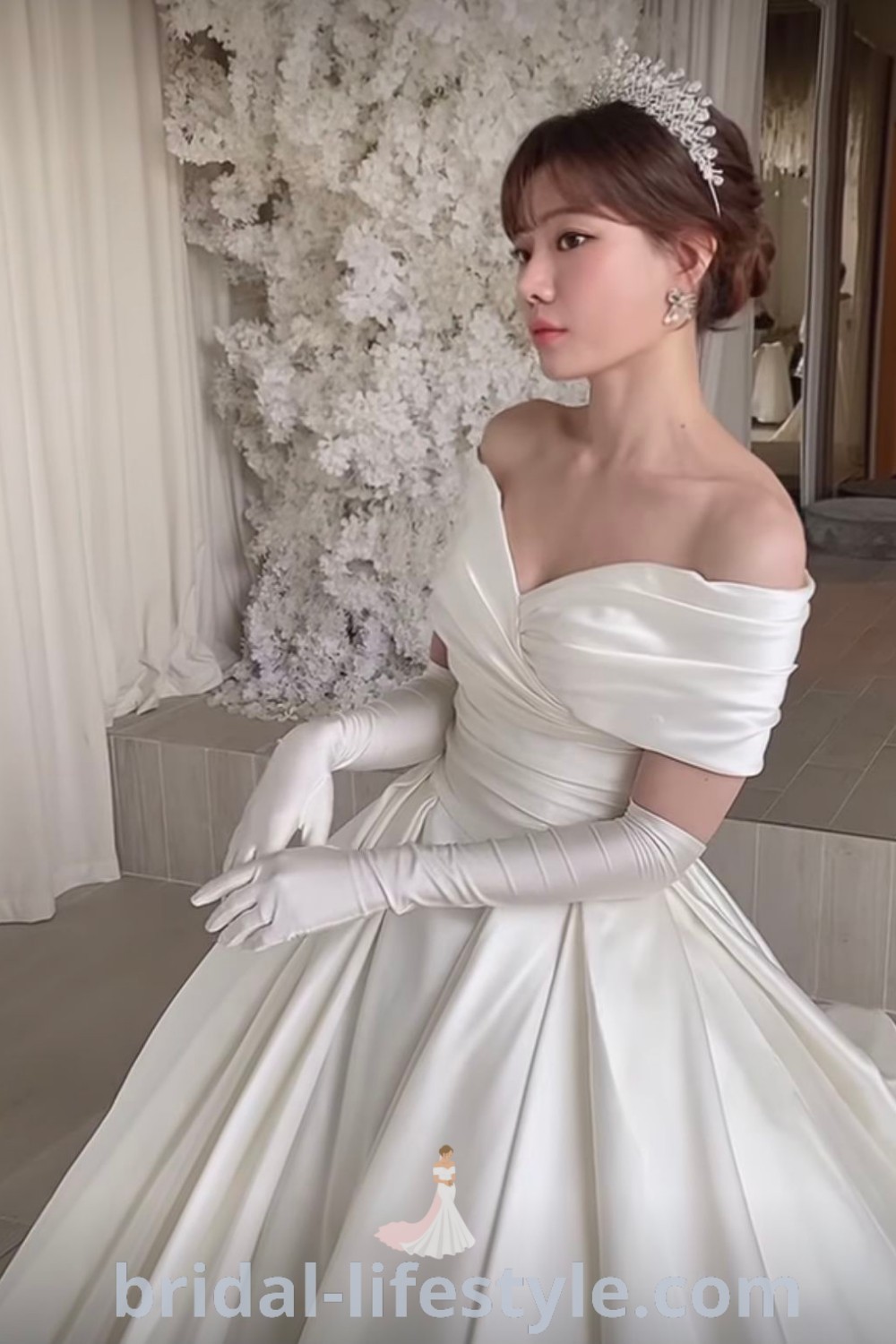 An elegant wedding outfit featuring a traditional ball gown with gloves, designed for brides seeking a romantic and dreamy look. This white gown is perfect for broad shoulders and offers timeless inspiration and best aesthetic ideas at bridal-lifestyle.com.
