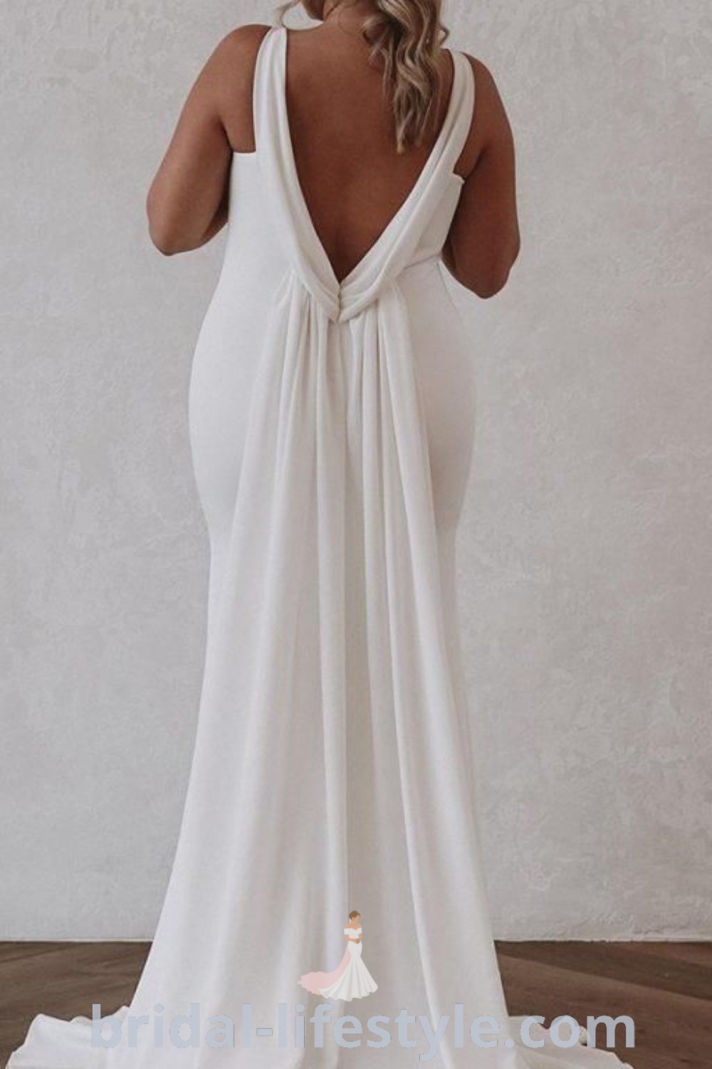 A woman in a white dress with her back to the camera, showcasing elegance and a romantic vibe, perfect for every bride’s unique taste. Discover dreamy bridal inspiration and the best aesthetic ideas at bridal-lifestyle.com.