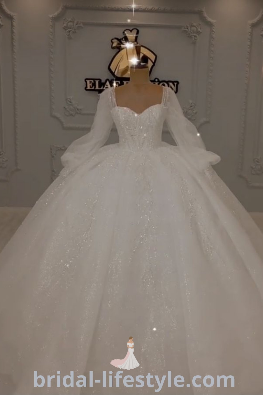 An elegant long sleeve white wedding dress on display, showcasing a beautiful ball gown silhouette. This dress embodies romantic trends and is perfect for dreamy brides seeking inspiration for their special day. Discover more stunning wedding dress ideas at bridal-lifestyle.com.