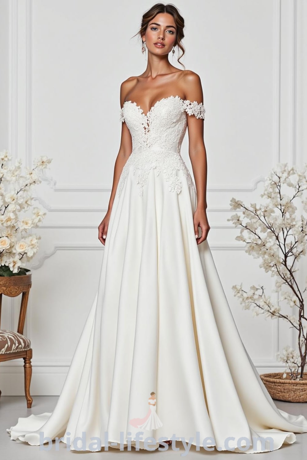 A-line wedding dress with off-the-shoulder neckline, lace appliqués on satin bodice, flowing skirt, and subtle beadwork. bridal-lifestyle.com