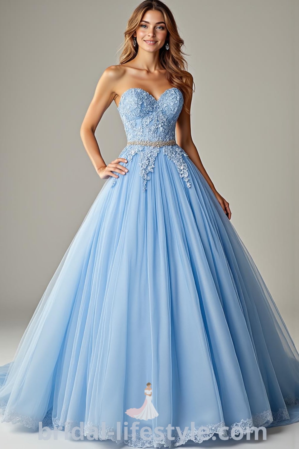Stunning Princess Blue wedding dress with satin bodice, lace appliqués, voluminous tulle skirt, sweetheart neckline, and satin ribbon cinched waist. bridal-lifestyle.com