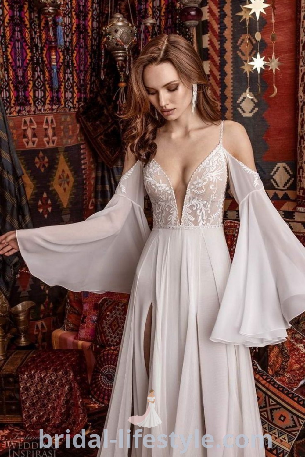 An elegant open-back wedding dress with straps and sleeves, featuring flare sleeves ideal for dreamy brides. This gorgeous gown offers a romantic and boho aesthetic, perfect for inspiring unique taste on the special day. Discover more elegant bridal styles at bridal-lifestyle.com.