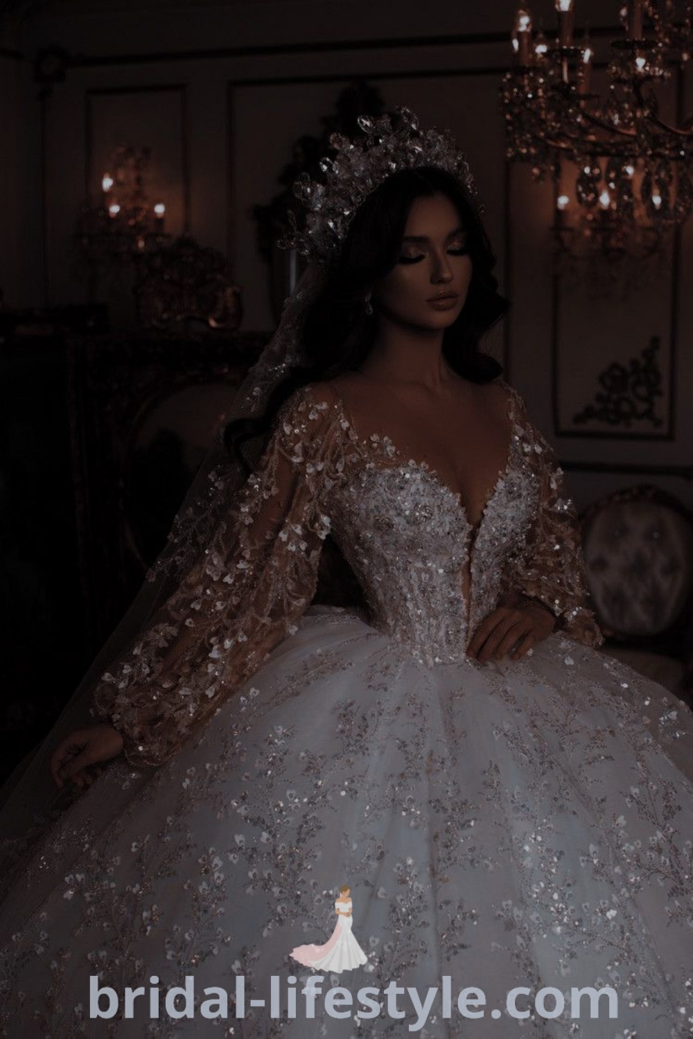 An elegant woman in a wedding dress ballgown standing next to a stunning chandelier, showcasing a dreamy bridal aesthetic ideal for extravagant wedding dresses and special occasions. This image reflects the best trends for every bride