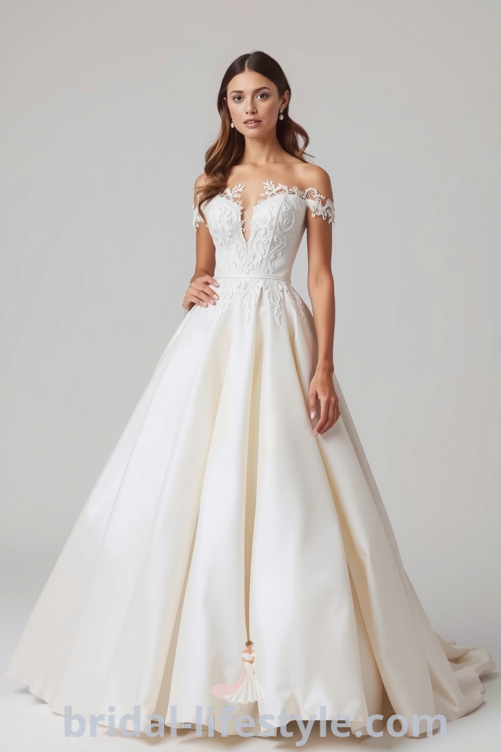 Elegant princess wedding dress in soft ivory satin with lace appliqués, off-the-shoulder neckline, and voluminous tulle skirt, perfect for dreamy brides seeking inspiration for their special day. bridal-lifestyle.com