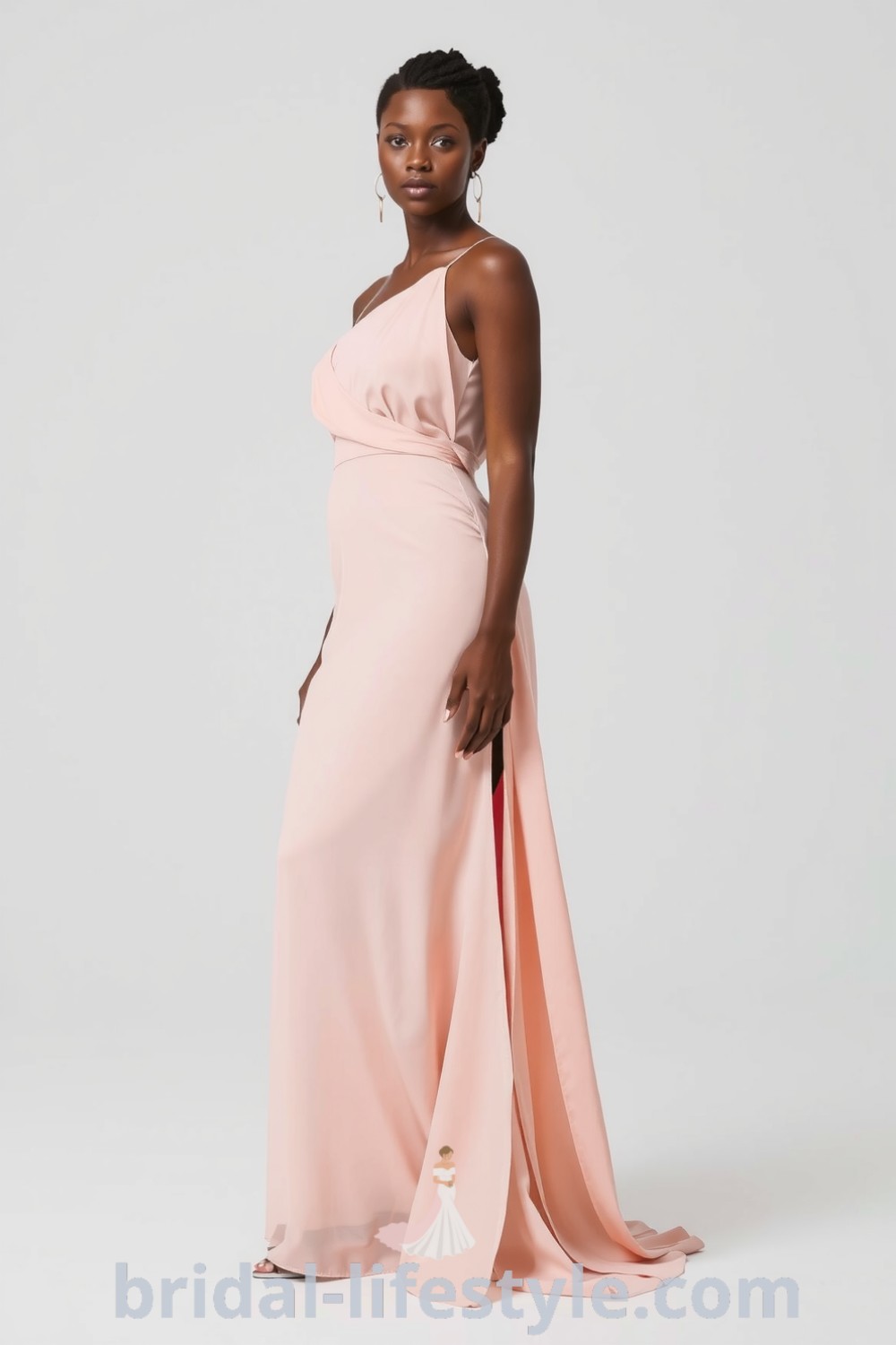 One-shoulder bridesmaid dress in flowing chiffon with a side slit, elegantly draping over a Black bride, enhancing her silhouette. bridal-lifestyle.com