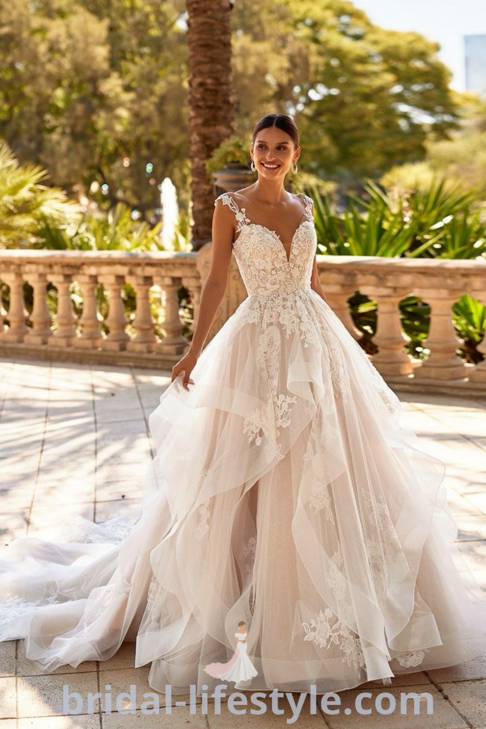 An elegant Moonlight Couture wedding dress featuring layers and floral details, ideal for a romantic bridal look. This stunning gown captures the fairy tale essence, making it a best choice for dreamy brides. Explore more options and inspiration looks at bridal-lifestyle.com.
