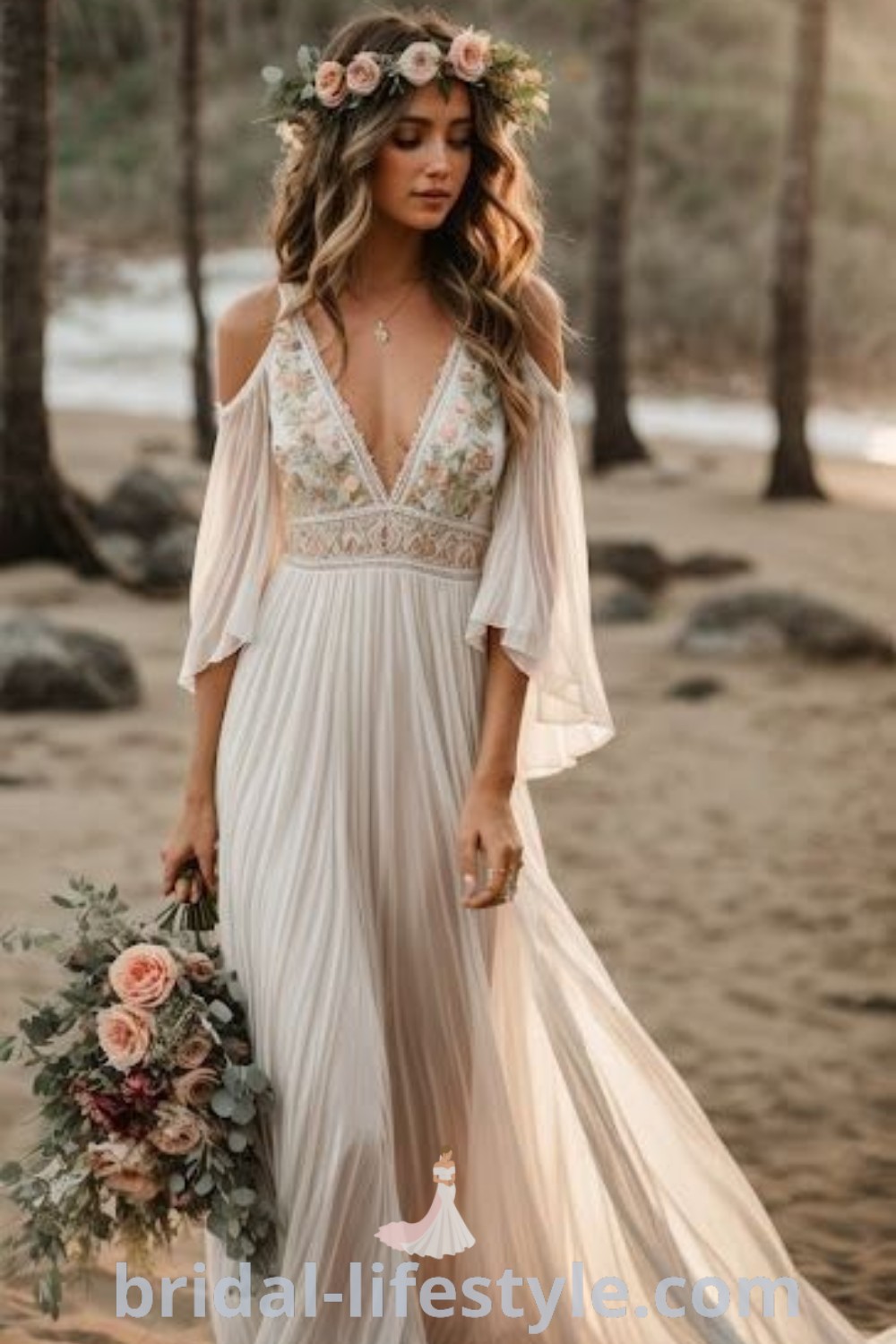 A woman in a white boho beach wedding dress stands on the beach holding a bouquet, surrounded by flowers. This elegant dress is ideal for beachy vow renewals and commitment ceremonies, capturing the best of bridal trends and dreamy aesthetics. Discover inspiration and ideas for your special day at bridal-lifestyle.com.