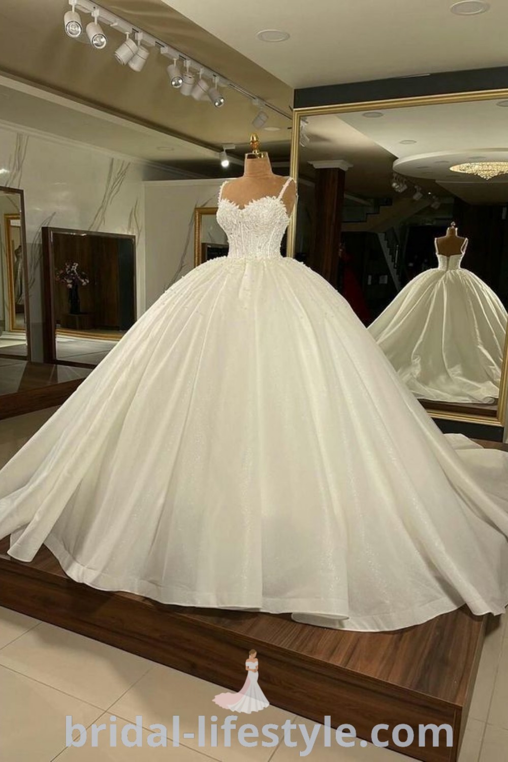 An elegant royalcore wedding dress with a gorgeous ball gown silhouette, perfect for brides seeking a dreamy and luxurious aesthetic. This stunning gown embodies royal elegance and is a top choice for special day inspirations. Explore the best bridal styles at bridal-lifestyle.com.