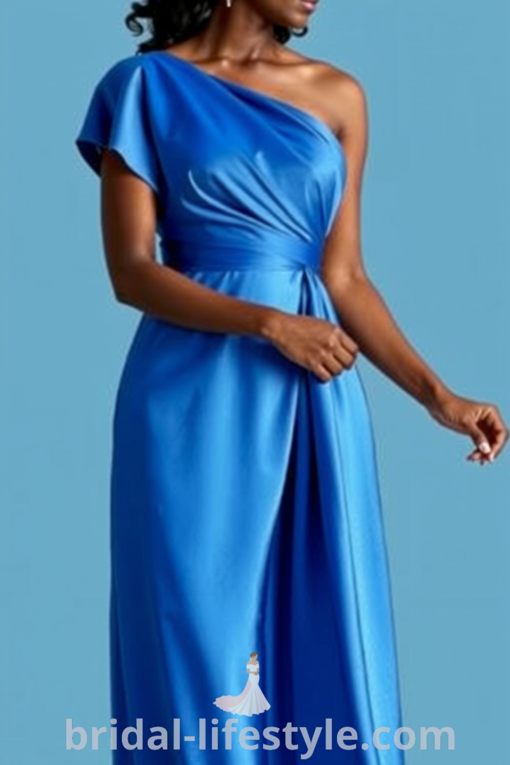 A full-length image of a Black bride wearing a stunning one-shoulder blue bridesmaid dress made of luxurious satin, featuring a delicate ruffle on the sleeve, ideal for dreamy brides seeking elegant aesthetics for their special day. bridal-lifestyle.com