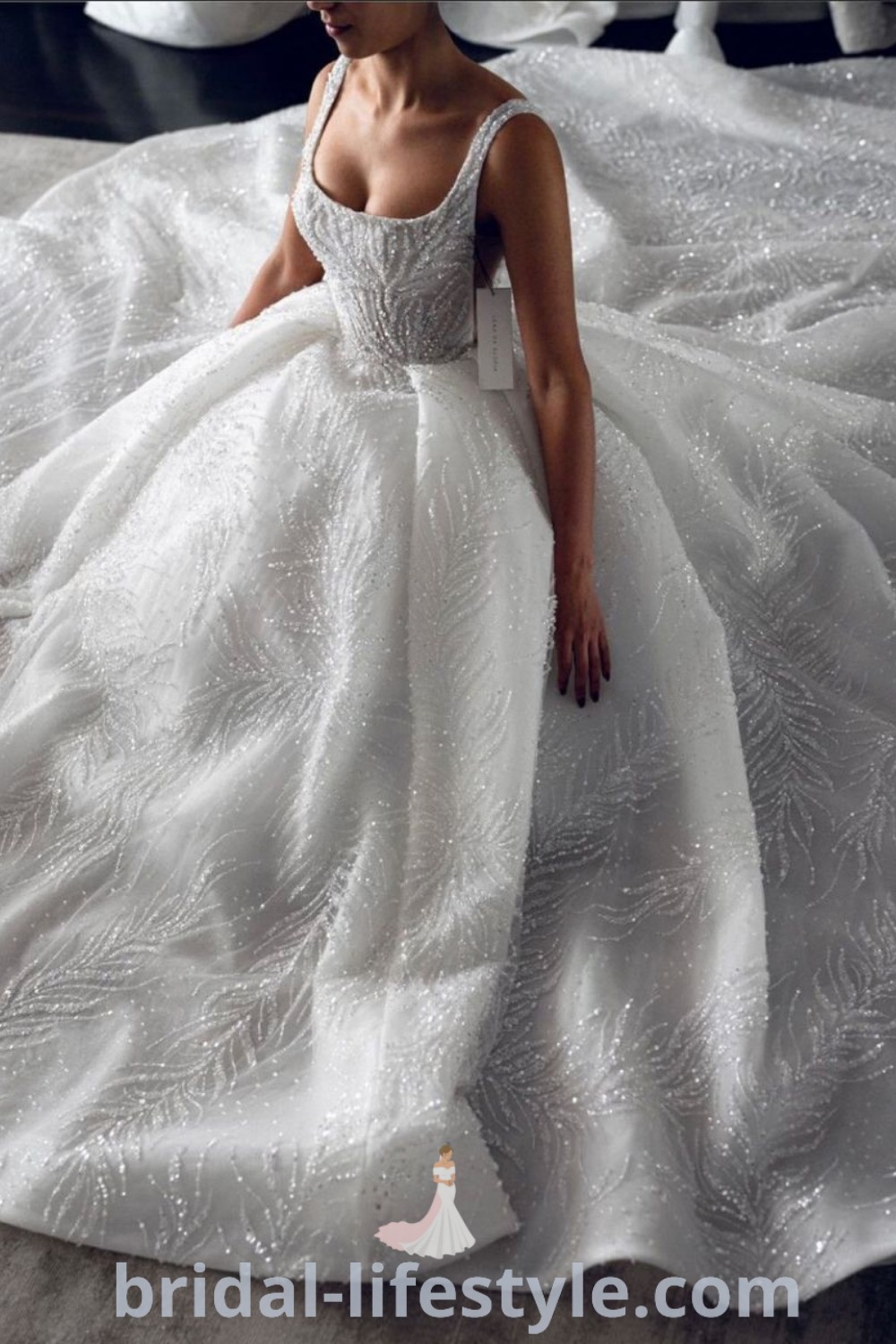 An elegant A-line wedding gown with a boned bodice and embroidered details, ideal for dreamy brides. This stylish dress is perfect for the special day and showcases the best trends in wedding fashion. Discover more unique inspiration looks at bridal-lifestyle.com.