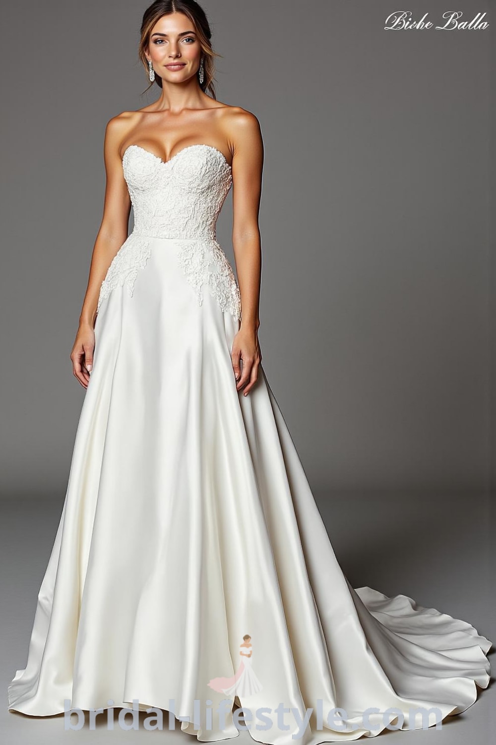 A-line satin wedding dress with a fitted bodice adorned with lace appliqués and a sweeping skirt, featuring a soft sweetheart neckline. bridal-lifestyle.com
